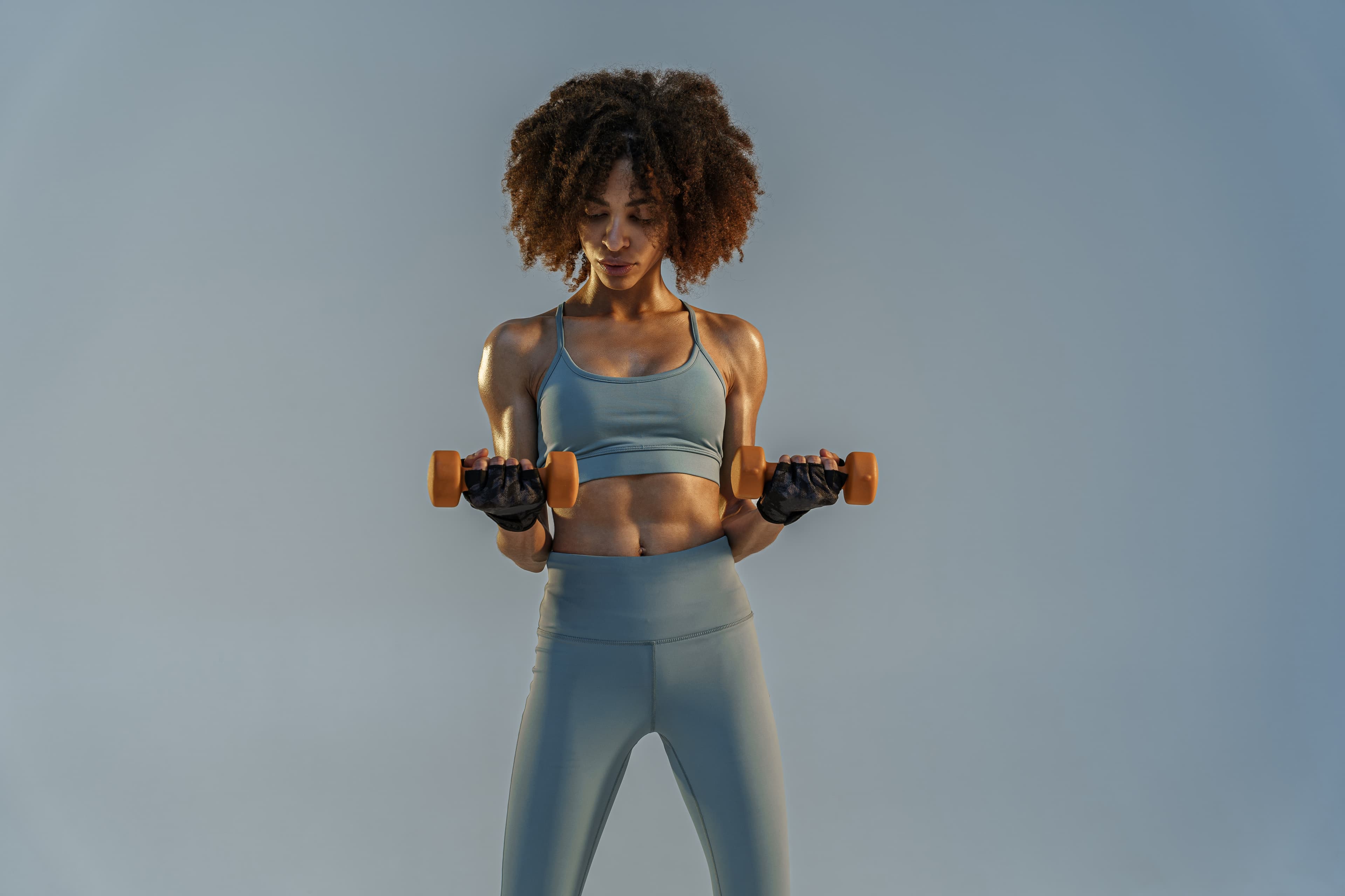 FitPlay athlete stretching in studio light